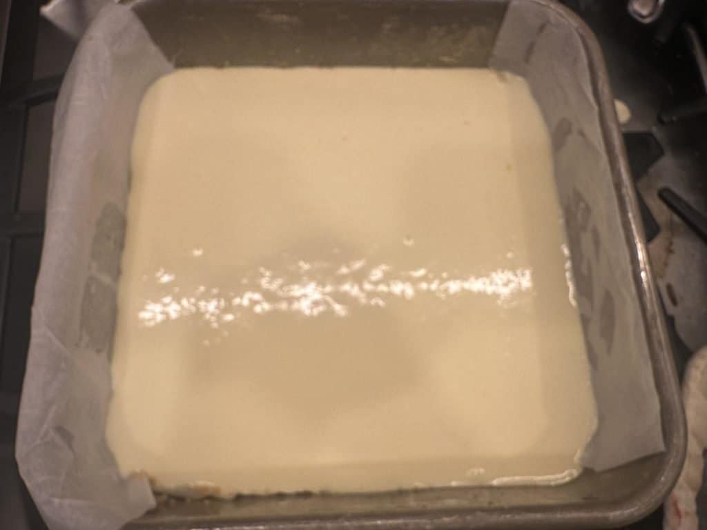 cheesecake mix poured over crust
