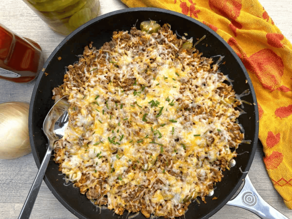 cheeseburger skillet with ground beef and melted cheese on top.